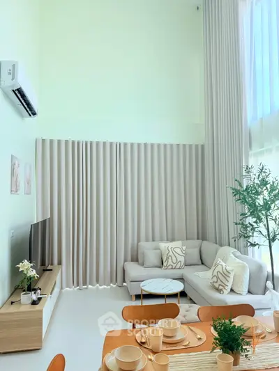 Spacious modern living room with high ceilings and elegant decor