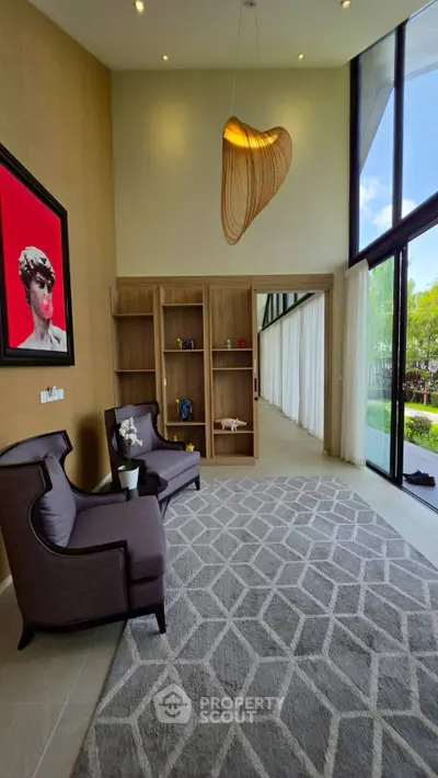 Luxurious living room with high ceilings, modern decor, and large windows offering garden views.