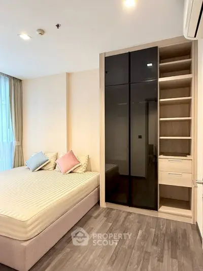 Modern bedroom with sleek wardrobe and cozy bed in a stylish apartment