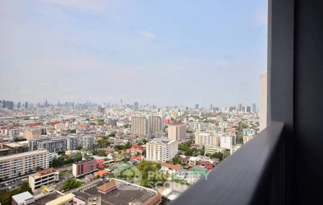 Stunning cityscape view from high-rise balcony, showcasing urban skyline and vibrant city life.