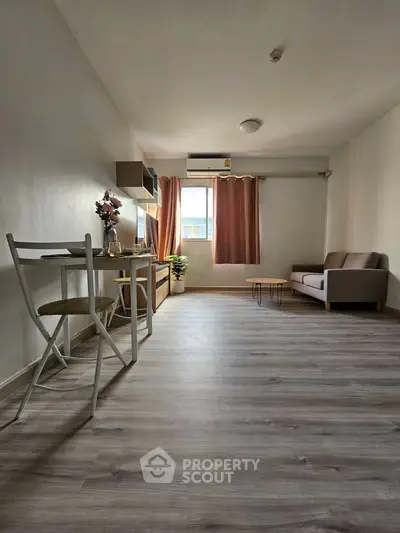 Spacious modern living room with stylish decor and natural light