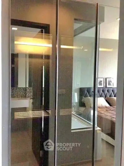 Modern bedroom with glass partition and stylish decor