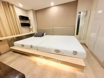 Spacious modern bedroom with elegant design and cozy lighting