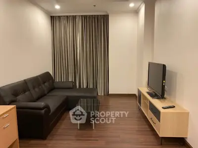 Modern living room with sleek furniture and wooden flooring