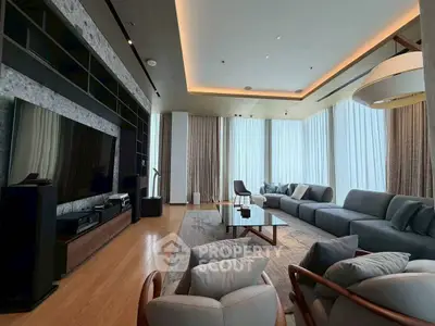 Luxurious modern living room with large windows and elegant furnishings.