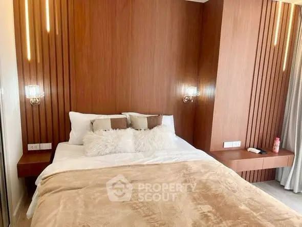 Luxurious bedroom with modern wooden paneling and cozy bedding