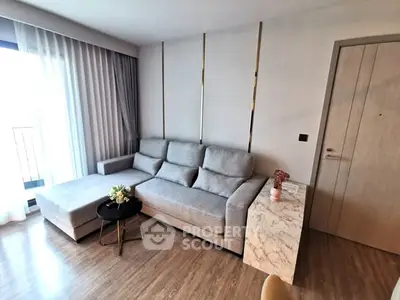 Modern living room with stylish gray sofa and elegant decor