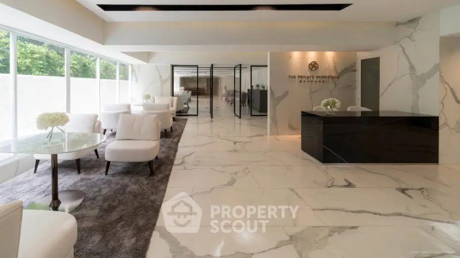 Luxurious modern lobby with marble flooring and elegant seating at The Private Residence.