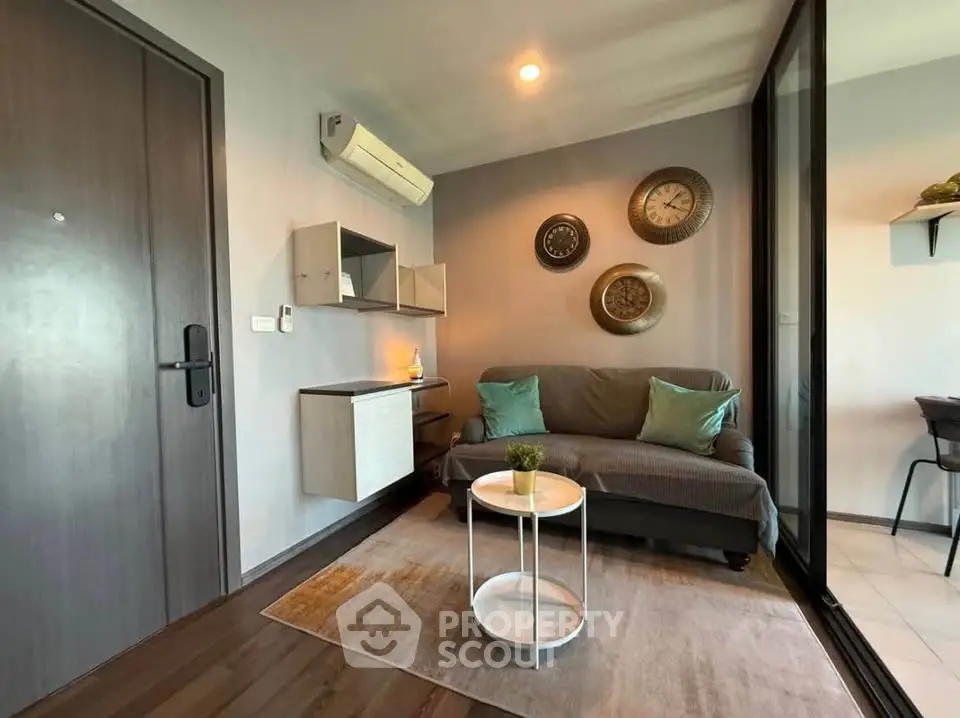 Cozy living room with modern decor and air conditioning in a stylish apartment.
