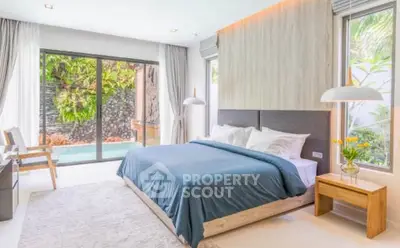 Luxurious bedroom with pool view and modern decor, featuring large windows and elegant lighting.