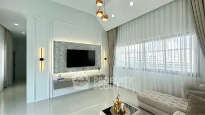 Luxurious modern living room with elegant decor and large windows