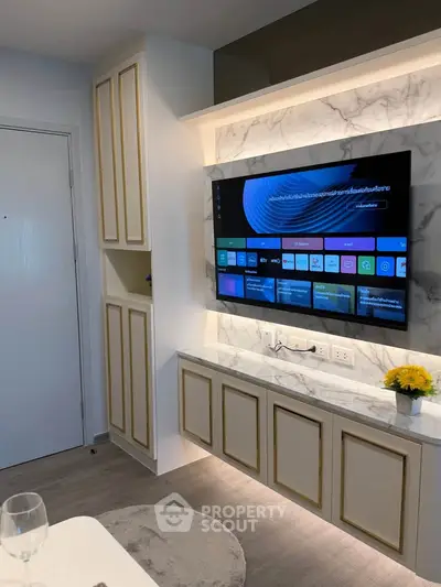 Modern living room with built-in TV unit and elegant marble accents
