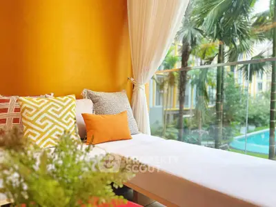 Luxurious balcony with vibrant decor and pool view, perfect for relaxation and leisure.