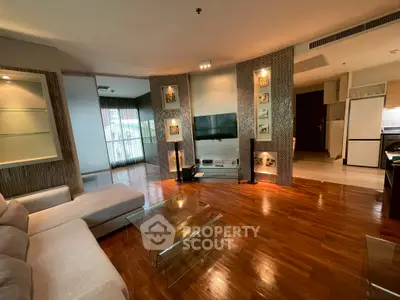 Spacious modern living room with hardwood floors and stylish decor