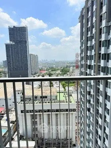 Stunning high-rise cityscape view from a modern apartment balcony, showcasing urban living at its finest.