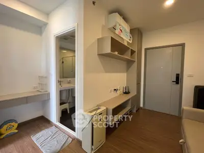 Modern apartment interior with wooden flooring and compact bathroom