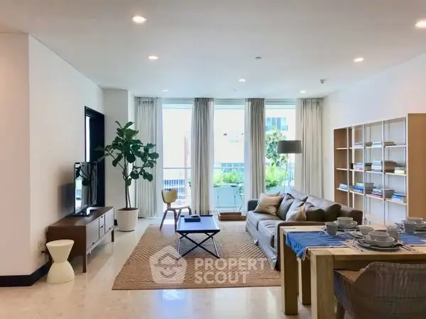 Spacious modern living room with natural light and stylish decor