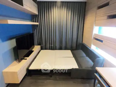 Modern living room with sofa bed and sleek wooden shelves, perfect for compact urban living.