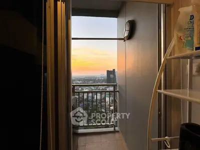 Stunning balcony view with sunset over cityscape, perfect for relaxation and enjoying urban living.