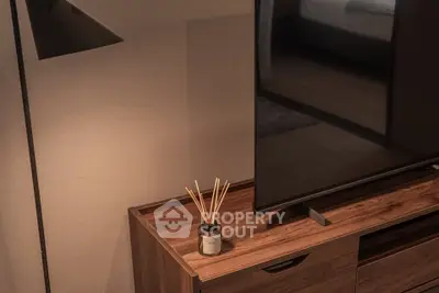 Modern living room with sleek TV stand and ambient lighting