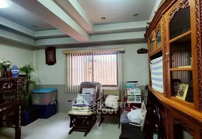 Cozy living room with classic wooden furniture and natural light