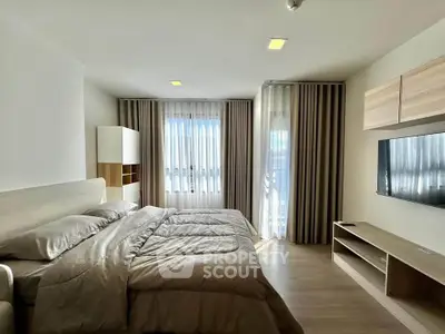 Modern bedroom with stylish decor and natural light