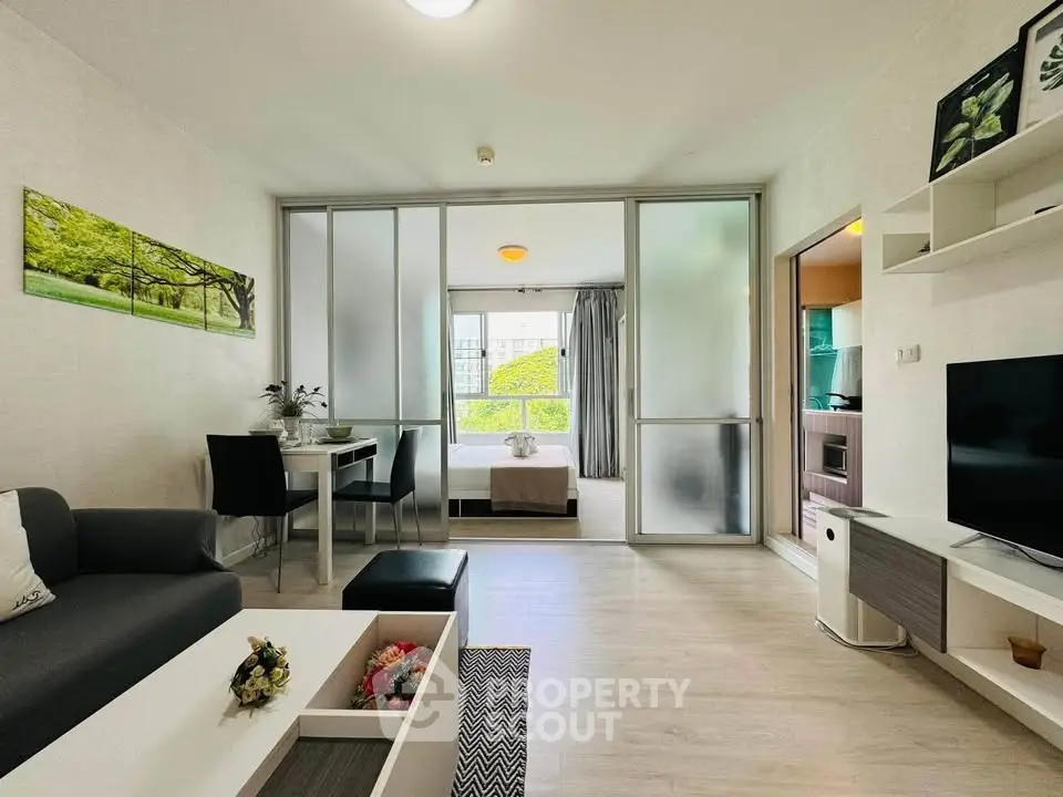 Modern living room with sliding glass doors and stylish decor