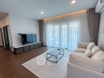 Spacious modern living room with elegant decor and natural light