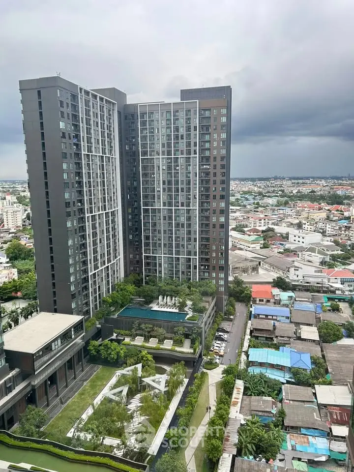 Stunning high-rise building with pool and lush gardens offering panoramic city views.