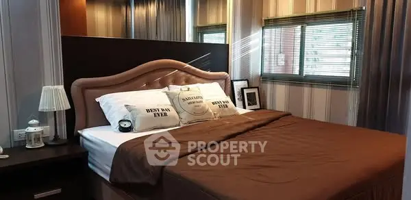 Cozy bedroom with elegant decor and plush bedding, perfect for relaxation.