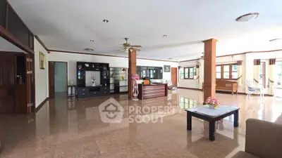 Spacious living room with elegant decor and glossy flooring