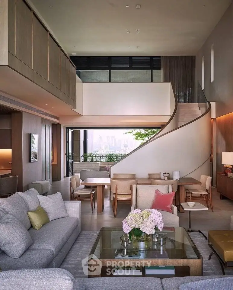 Luxurious modern living room with high ceilings, elegant furniture, and stunning city view.