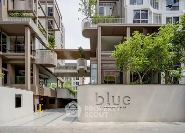 Modern architectural building with lush greenery and stylish design at Blue Phahonyothin 35.