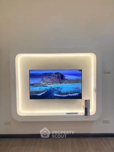 Modern living room with stylish TV wall mount and ambient lighting