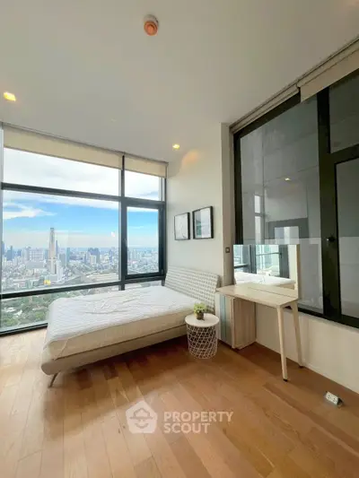 Modern bedroom with stunning city view and large windows