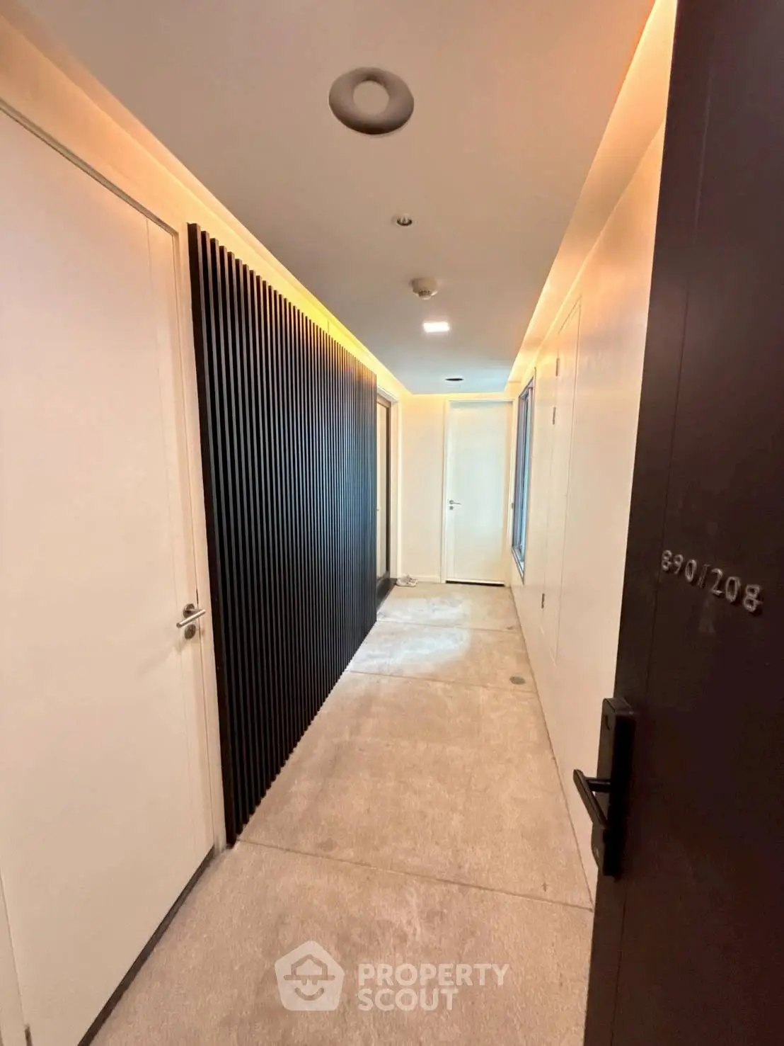 Modern apartment corridor with sleek design and ambient lighting