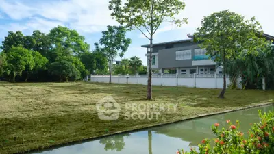 Spacious residential property with lush garden and serene water feature
