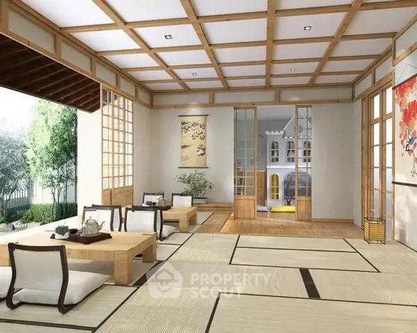 Elegant Japanese-style living room with tatami mats and sliding doors opening to a serene garden view.
