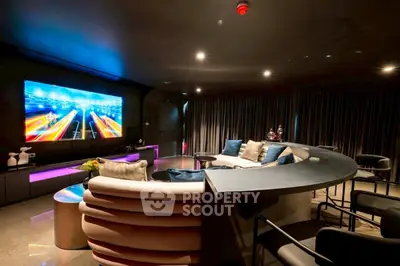 Luxurious home theater with plush seating and ambient lighting for ultimate entertainment experience.