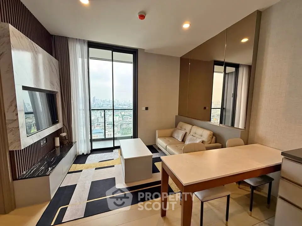 Modern living room with city view, featuring sleek furniture and large windows for natural light.