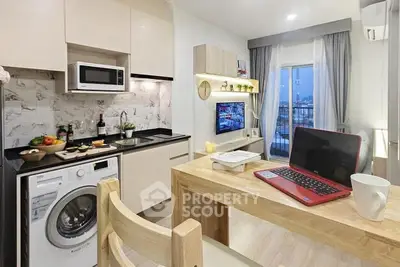 Modern kitchen with washing machine and open layout, featuring a cozy dining area and city view.