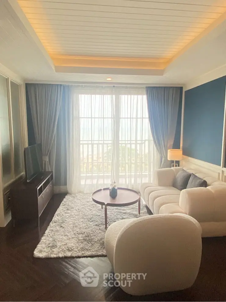 Luxurious modern living room with stylish furniture and large windows