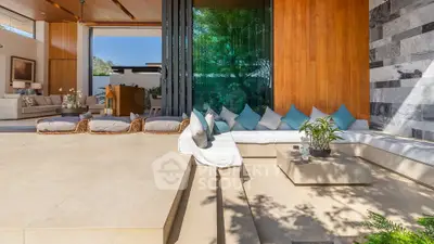 Luxurious open-plan living area with modern design and spacious seating, perfect for relaxation and entertaining.