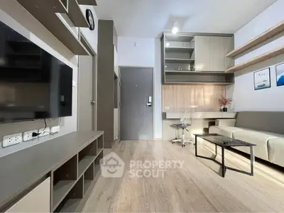 Modern living room with sleek furniture and wooden flooring