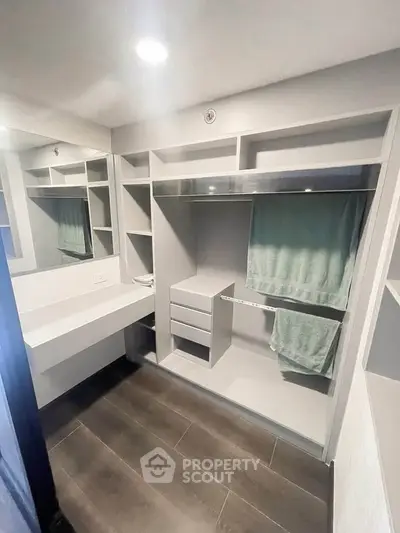 Spacious walk-in closet with modern shelving and ample storage space.