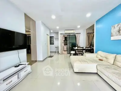 Spacious living room with modern decor and large sectional sofa