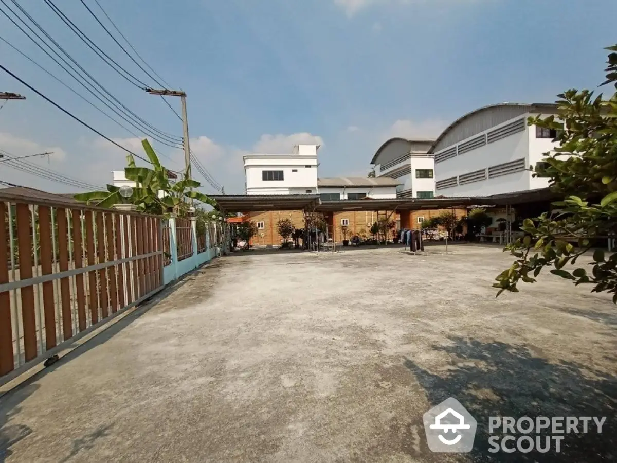 Spacious residential building with large open courtyard and clear blue sky