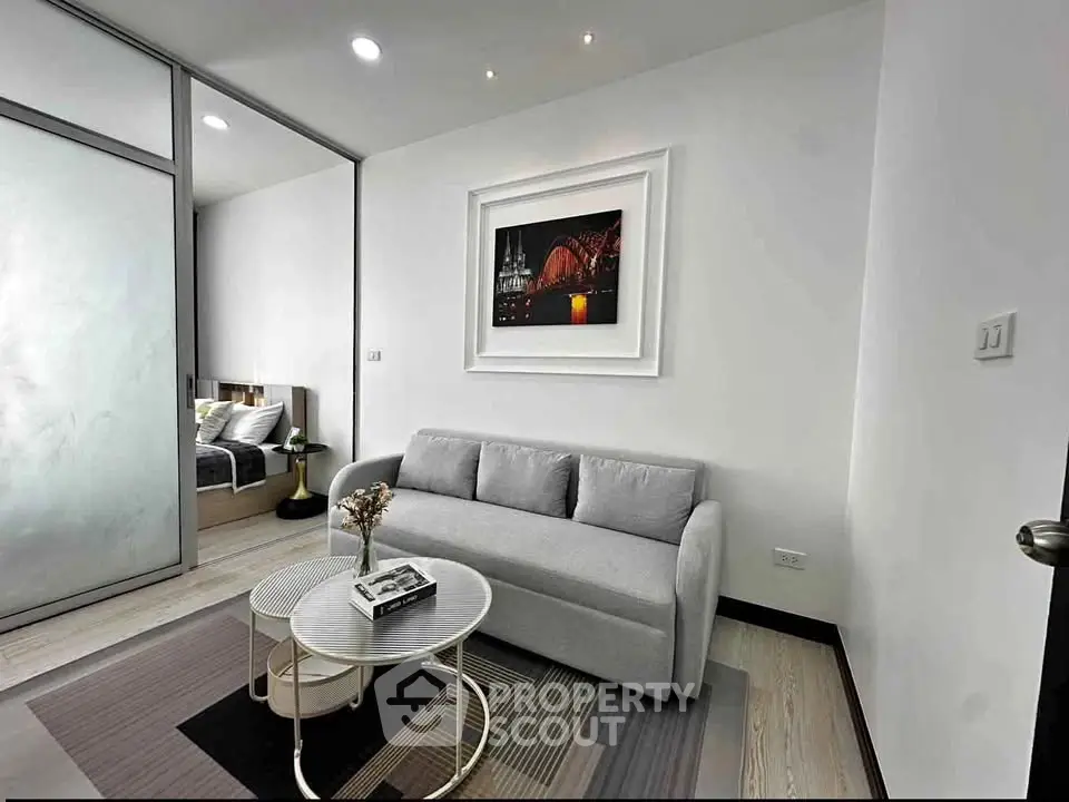 Modern living room with stylish decor and cozy sofa in a contemporary apartment.