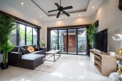 Spacious modern living room with large windows and stylish decor