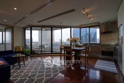 Spacious modern living room with city view and open kitchen layout